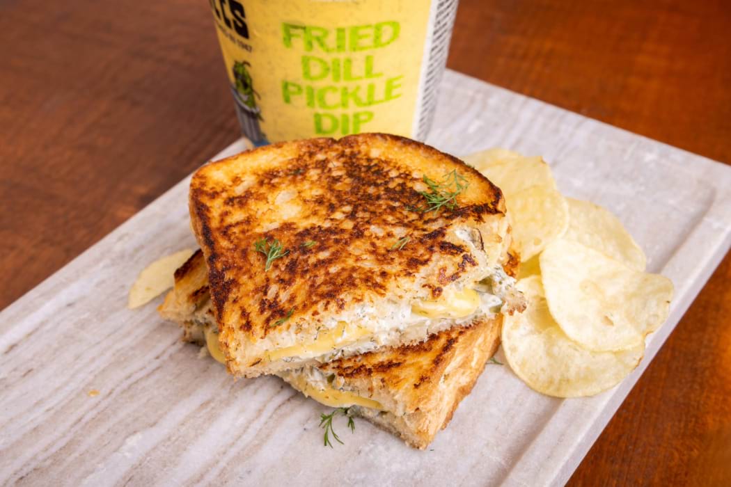 Grilled cheese with fried pickle dip, dill havarti, provolone and dill pickle chips