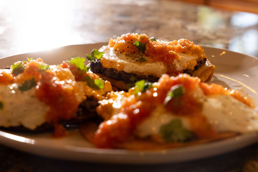 Huevos rancheros with Knott's pimiento cheese, homemade salsa eggs and beans