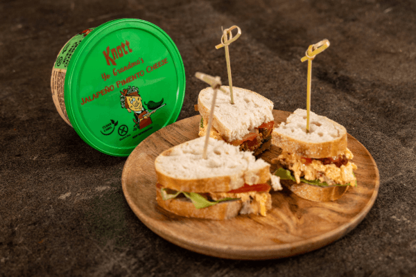 knott yo grandmas jalapeno pimento cheese next to sandwiches